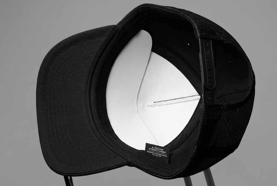 Inside view of a custom A-frame cap revealing the durable hard buckram backing