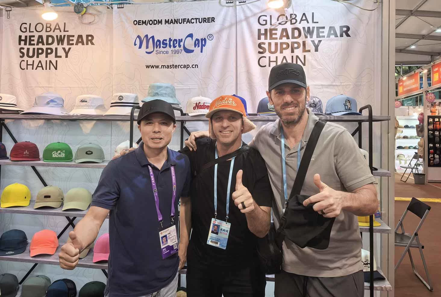 MasterCap team posing with satisfied international headwear buyers at the Canton Fair